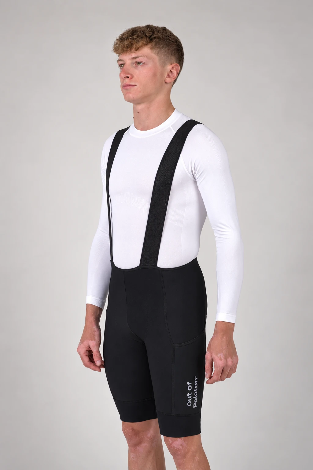 Inertia Thermal Cargo Bib in black, studio three-quarter view